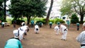 Asian elderly people practicing Tai Chi at public park